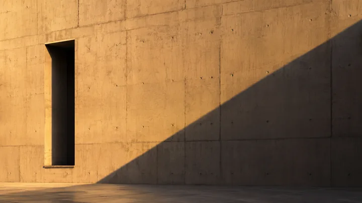 Minimal concrete architecture AI wallpaper in raking afternoon light, desktop