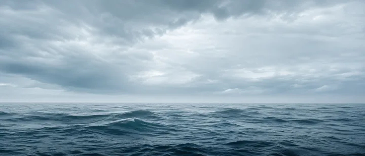 Ultrawide ocean AI wallpaper with a long horizon under overcast light